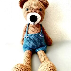 Handmade Crochet Teddy Bear with Blue Overalls.